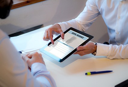 Patient reviewing dental insurance information on tablet