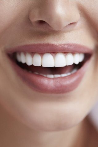 Close up of smile with straight white teeth