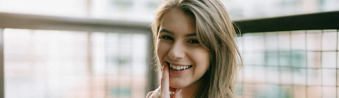 Woman Smiling On Balcony